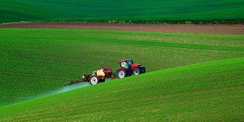 Farm machinery spraying insecticide